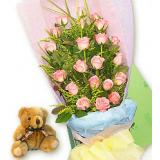 鲜花:11枝红超玫瑰，配满天星点缀、绿叶，圆形花束,浅色棉纸包装